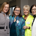 Image of 4 women, the AIIW team, smiling for a photo- Brand identity Newcastle, Brand identity Newcastle